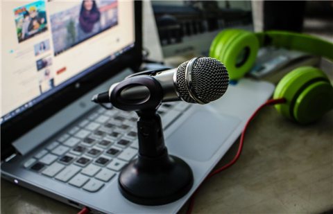Desktop microphone and headphones setup used alongside a USB audio interface for recording Desktop microphone and headphones setup used alongside a USB audio interface for recording
