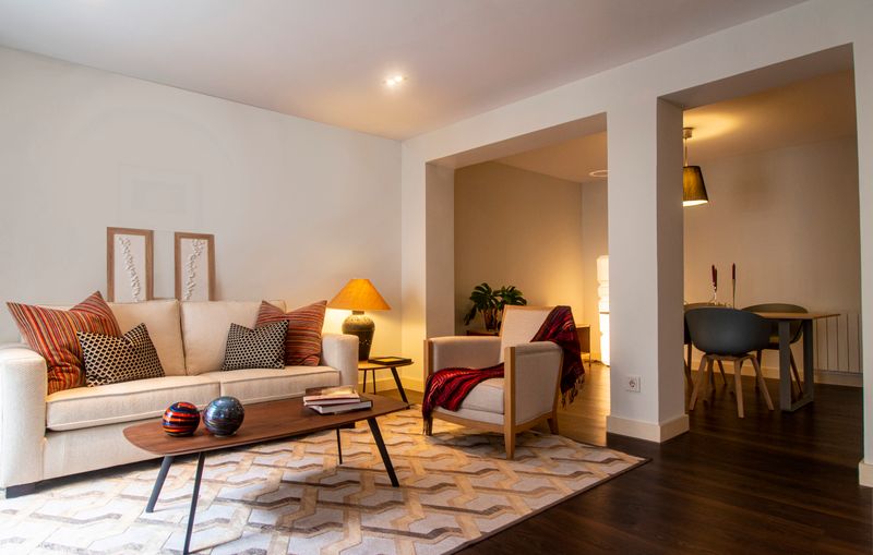 Living room with warm ambient lighting created by a connected smart lighting system Living room with warm ambient lighting created by a connected smart lighting system
