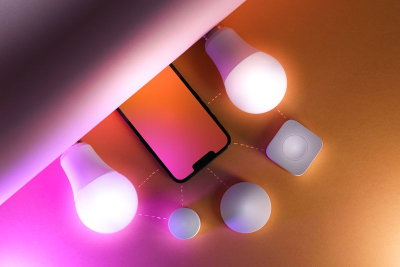 Smart light bulbs and a small hub device connected through a smartphone app Smart light bulbs and a small hub device connected through a smartphone app