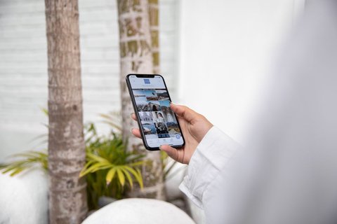 Close-up of a hand checking a companion fitness app on a smartphone screen Close-up of a hand checking a companion fitness app on a smartphone screen