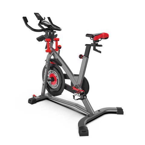 Schwinn IC4 indoor cycling bike with console and dumbbell holders shown from the side Schwinn IC4 indoor cycling bike with console and dumbbell holders shown from the side