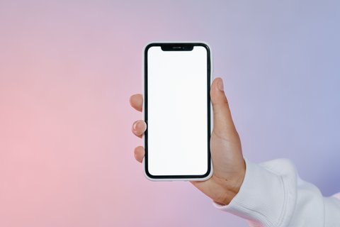 Smartphone held in hand representing the Sound Connect app used to update headphone firmware Smartphone held in hand representing the Sound Connect app used to update headphone firmware