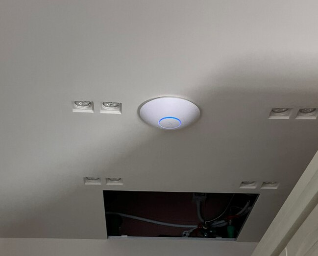 Ubiquiti UniFi wireless access point mounted before a firmware update Ubiquiti UniFi wireless access point mounted before a firmware update