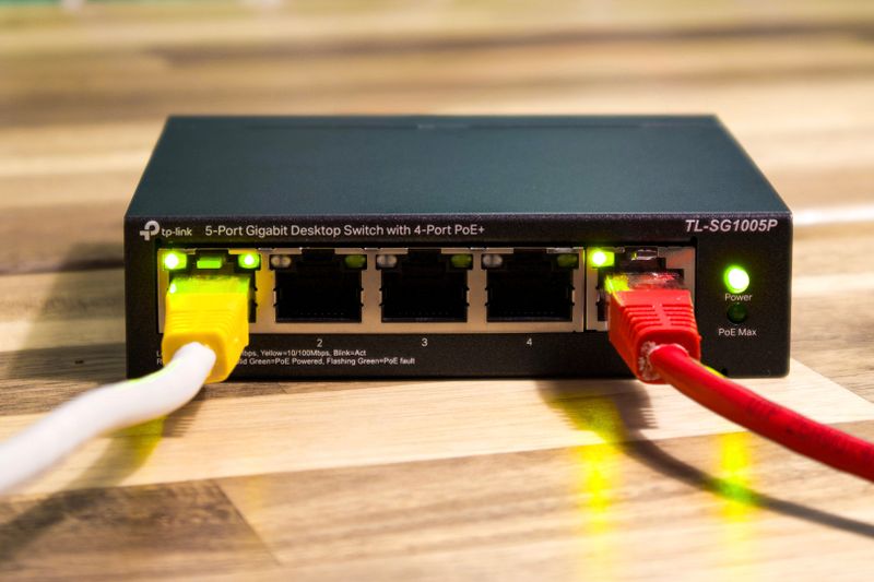 Network switch with cables connected during a UniFi firmware upgrade session Network switch with cables connected during a UniFi firmware upgrade session
