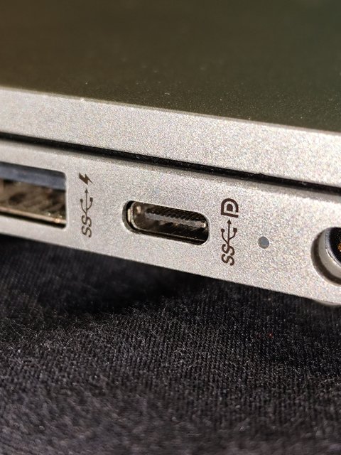 Close-up of a laptop USB port used for connecting a point-of-sale receipt printer Close-up of a laptop USB port used for connecting a point-of-sale receipt printer